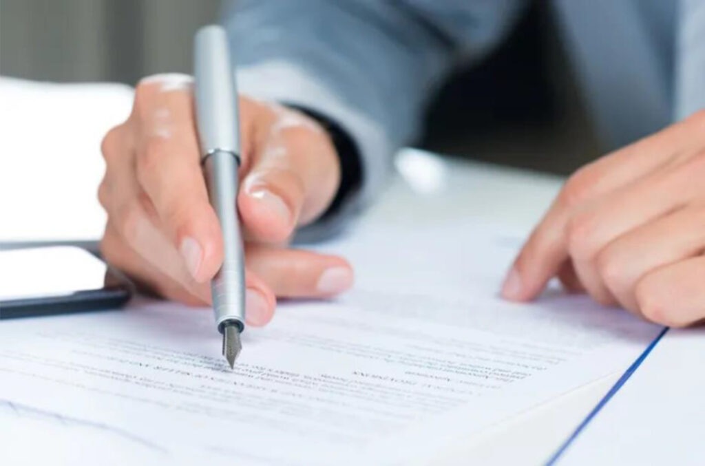 A person signing a document